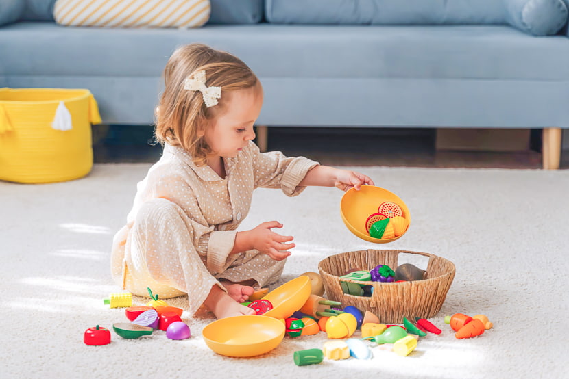 Place toys on easy-to-carry trays or in small baskets to naturally encourage children to return them after use