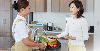 A housekeeper talking with a customer