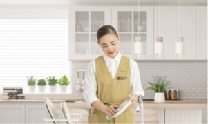 Housekeeper washing dishes